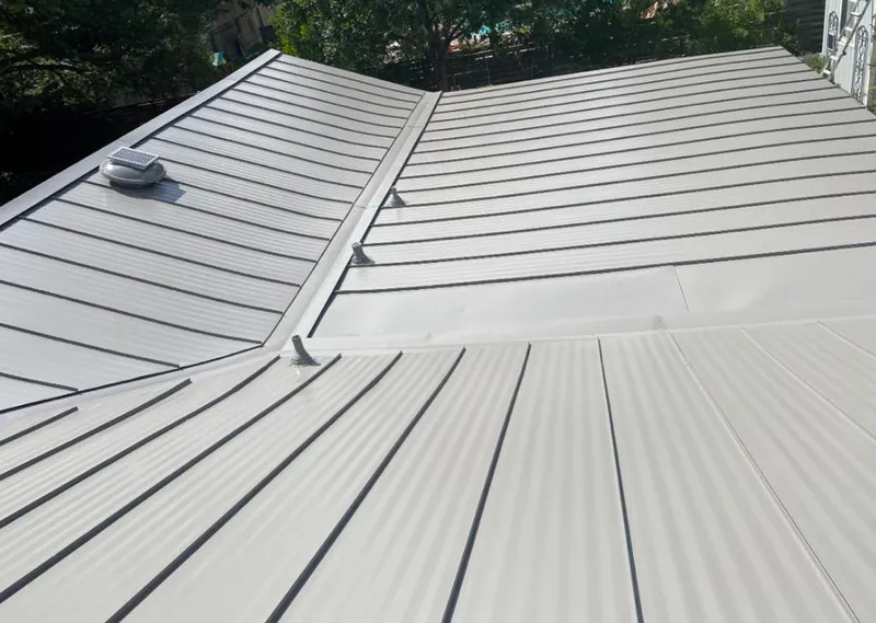Solar attic fan installed on a metal roof for Roof Ventilation in Punta Gorda